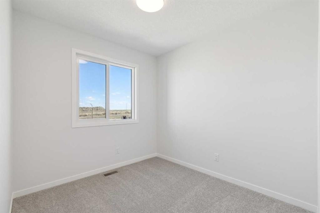 74 Lucas Heath Nw, Calgary, AB - Indoor Photo Showing Other Room