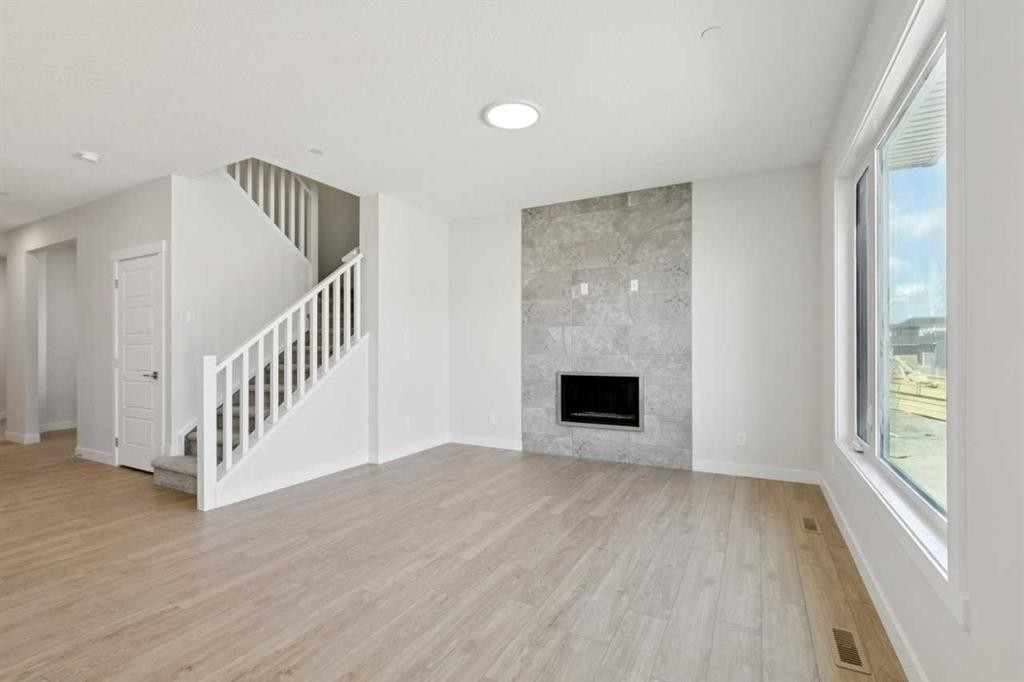 322 Hotchkiss Common Se, Calgary, AB - Indoor With Fireplace