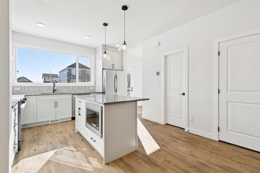 339 Fireside Drive, Cochrane, AB - Indoor Photo Showing Kitchen With Upgraded Kitchen