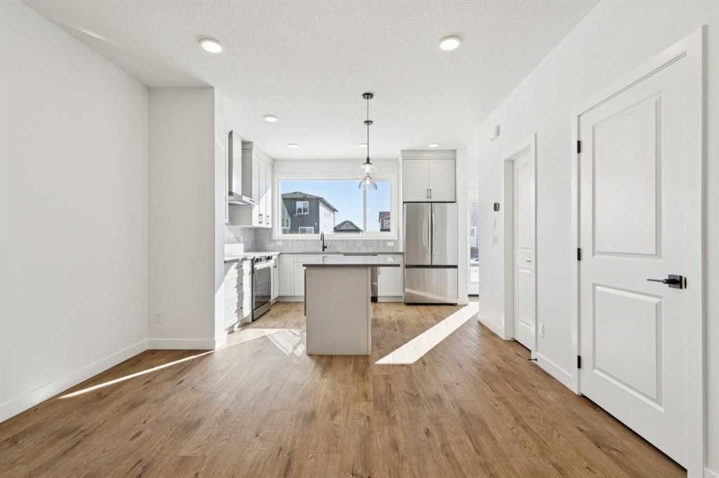 339 Fireside Drive, Cochrane, AB - Indoor Photo Showing Kitchen With Upgraded Kitchen