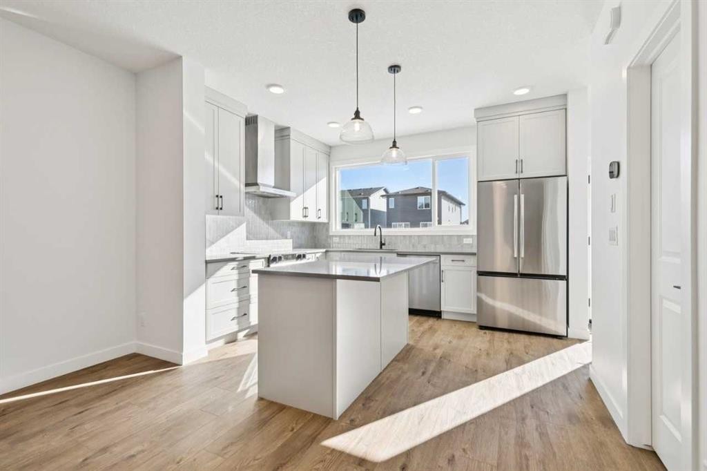 339 Fireside Drive, Cochrane, AB - Indoor Photo Showing Kitchen With Upgraded Kitchen