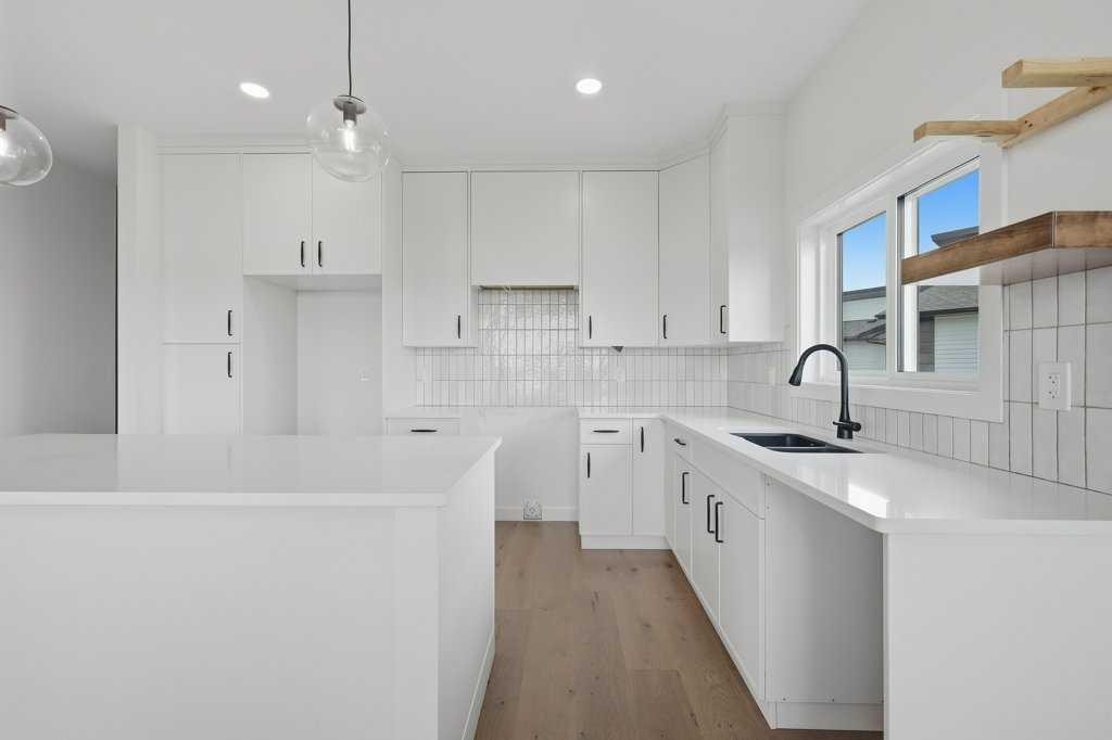 37 Maclean Close, Blackfalds, AB - Indoor Photo Showing Kitchen With Double Sink With Upgraded Kitchen