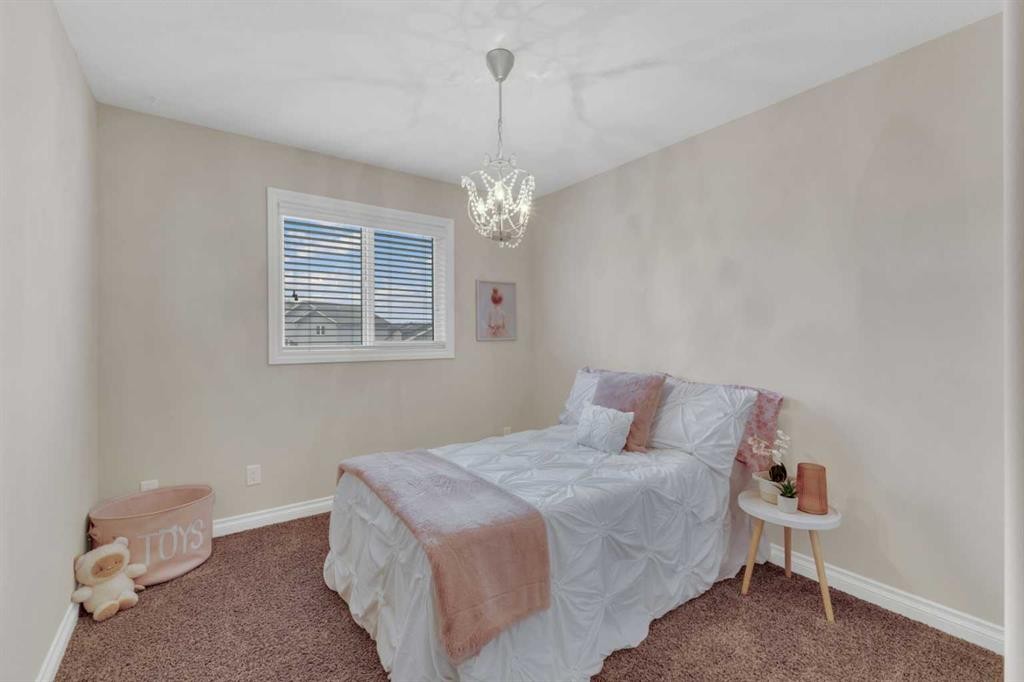 9 Ross Close, Sylvan Lake, AB - Indoor Photo Showing Bedroom
