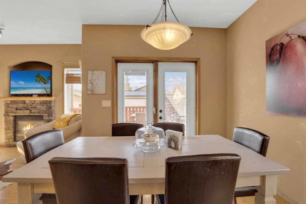 22 Jenner Crescent, Red Deer, AB - Indoor Photo Showing Dining Room With Fireplace