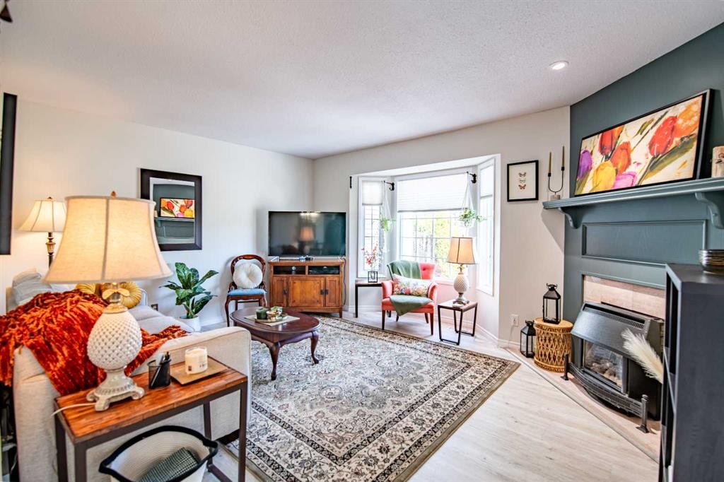 9 Rutherford Place, Red Deer, AB - Indoor Photo Showing Living Room With Fireplace