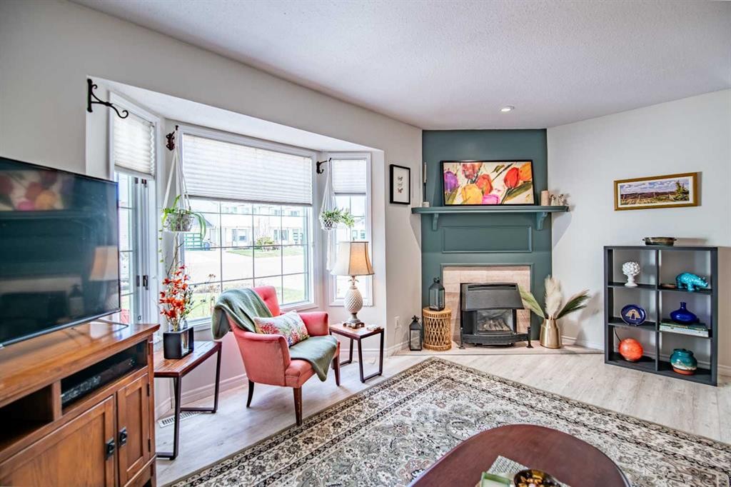 9 Rutherford Place, Red Deer, AB - Indoor Photo Showing Living Room With Fireplace