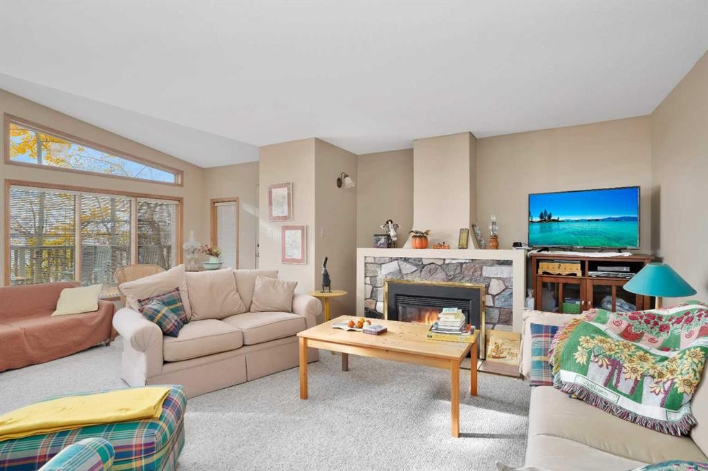 133 Birchcliff Road, Birchcliff, AB - Indoor Photo Showing Living Room With Fireplace