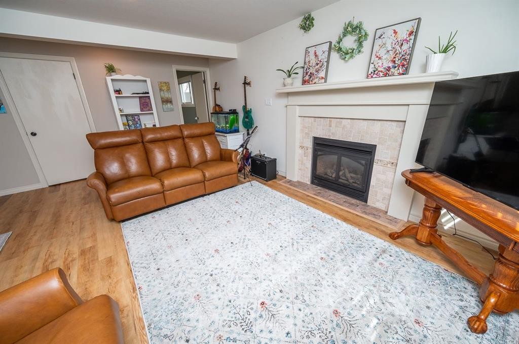 25 Gilbert Crescent, Red Deer, AB - Indoor Photo Showing Living Room With Fireplace