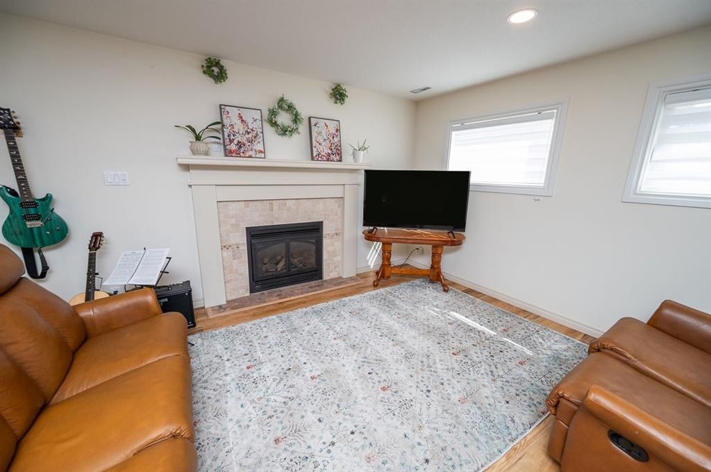 25 Gilbert Crescent, Red Deer, AB - Indoor Photo Showing Living Room With Fireplace