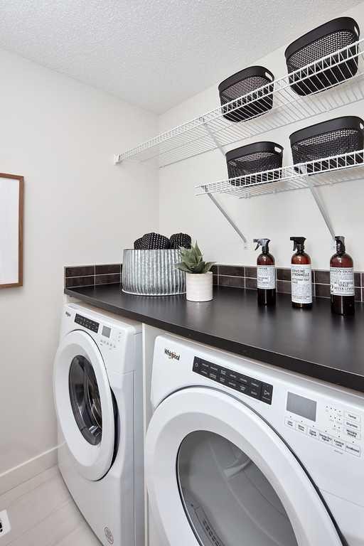 76 Emberside Grove, Cochrane, AB - Indoor Photo Showing Laundry Room