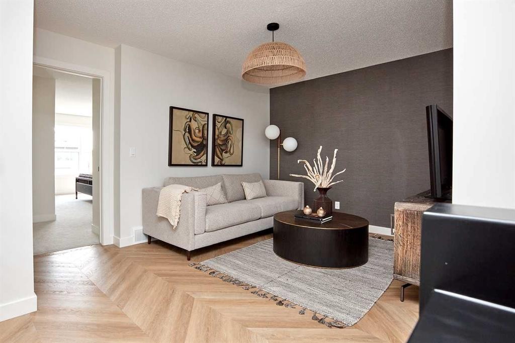 76 Emberside Grove, Cochrane, AB - Indoor Photo Showing Living Room