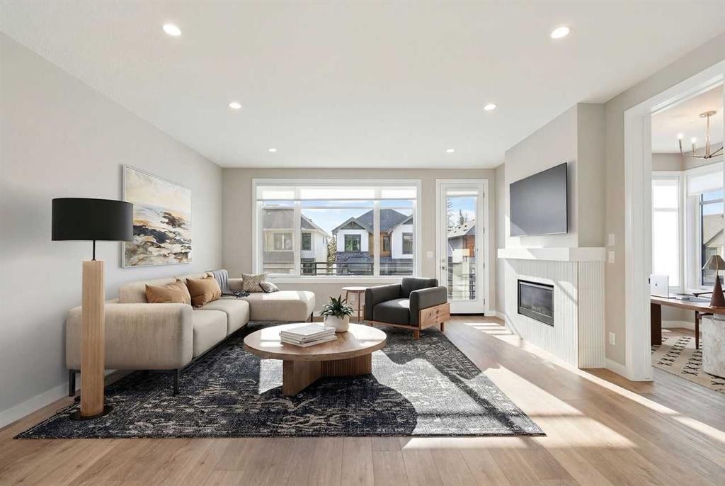 413 Shawnee Terrace Sw, Calgary, AB - Indoor Photo Showing Living Room With Fireplace