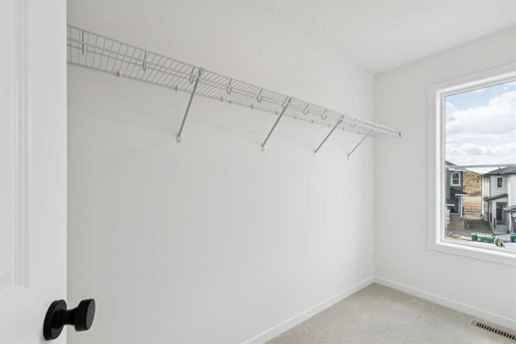 17 Southborough Common, Cochrane, AB - Indoor With Storage