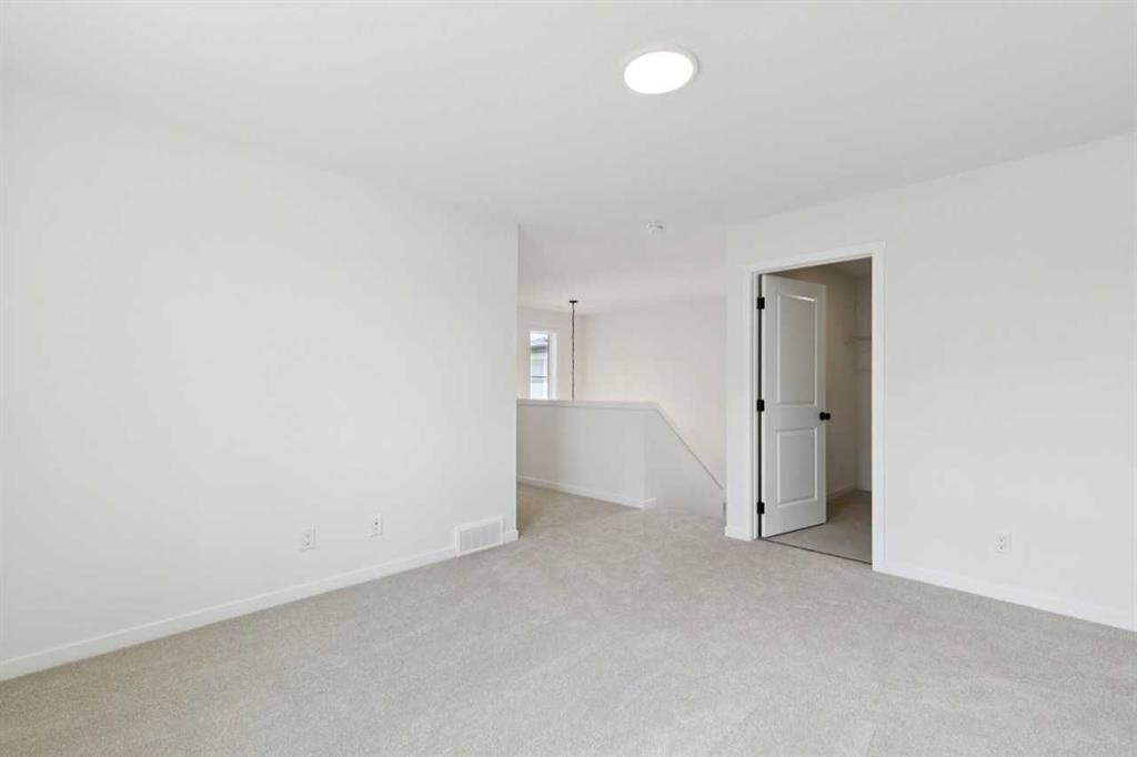 17 Southborough Common, Cochrane, AB - Indoor Photo Showing Other Room
