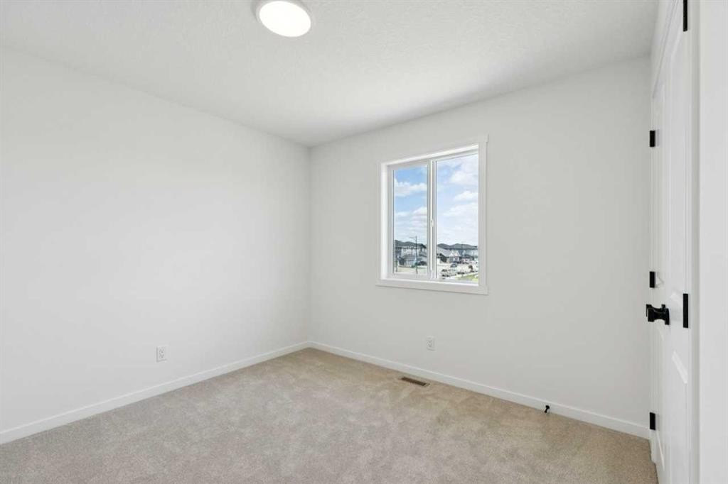 17 Southborough Common, Cochrane, AB - Indoor Photo Showing Other Room