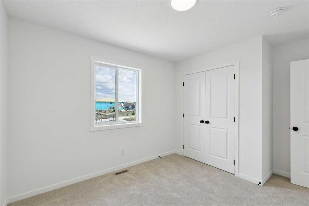 17 Southborough Common, Cochrane, AB - Indoor Photo Showing Other Room