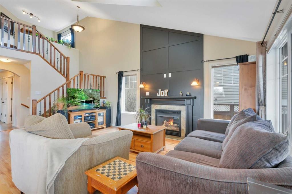 100 Wade Close, Red Deer, AB - Indoor Photo Showing Living Room With Fireplace
