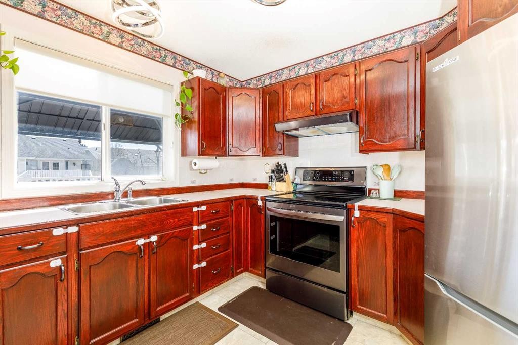 49 Kirkland Drive, Red Deer, AB - Indoor Photo Showing Kitchen With Double Sink