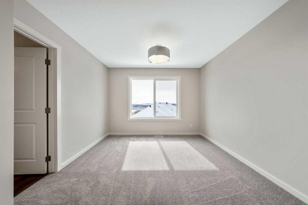 366 Heritage Boulevard, Cochrane, AB - Indoor Photo Showing Other Room