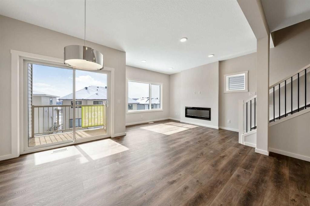 366 Heritage Boulevard, Cochrane, AB - Indoor Photo Showing Other Room With Fireplace