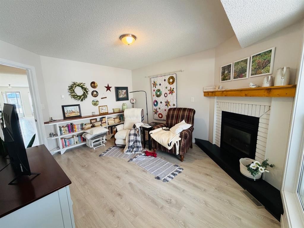4741 49A Avenue, Lacombe, AB - Indoor With Fireplace