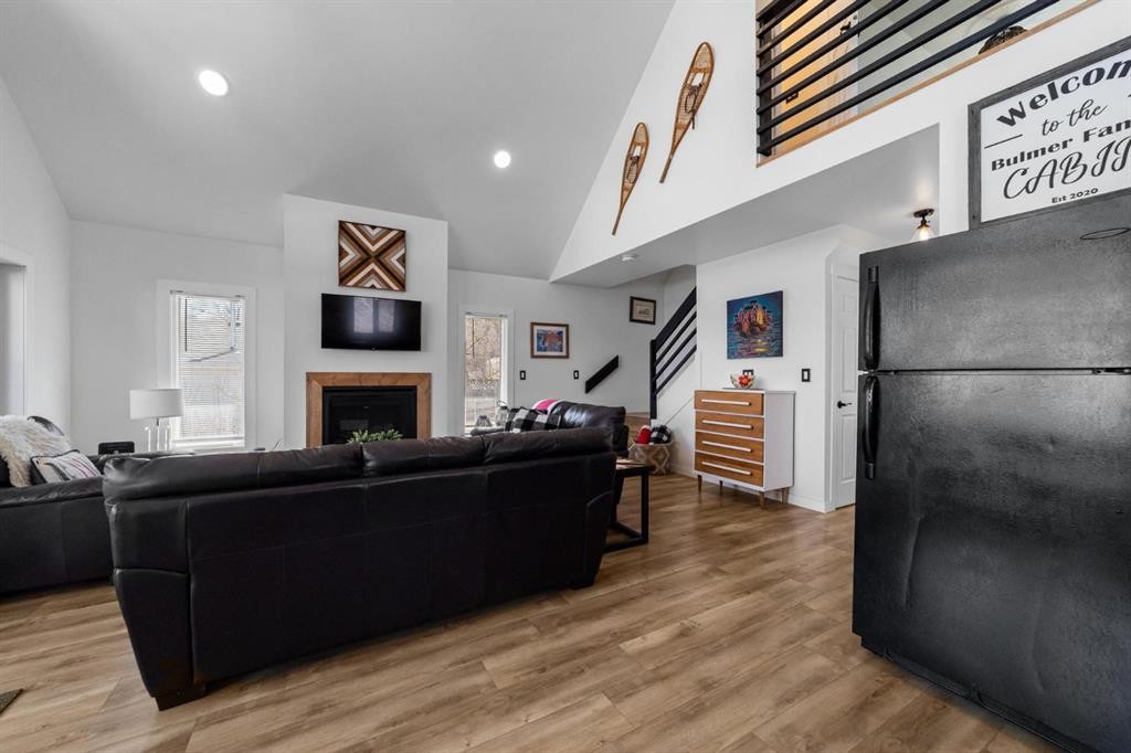 62 Sands Street, Rochon Sands, AB - Indoor Photo Showing Living Room With Fireplace