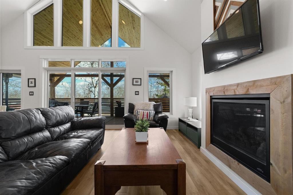 62 Sands Street, Rochon Sands, AB - Indoor Photo Showing Living Room With Fireplace
