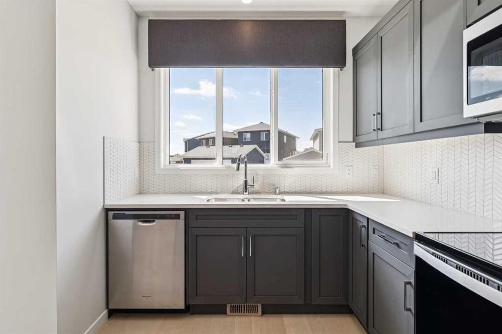 259 Chelsea Road, Chestermere, AB - Indoor Photo Showing Kitchen With Double Sink