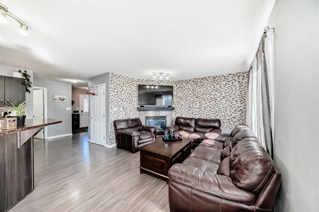 227 Avena Circle, Leduc, AB - Indoor Photo Showing Living Room With Fireplace