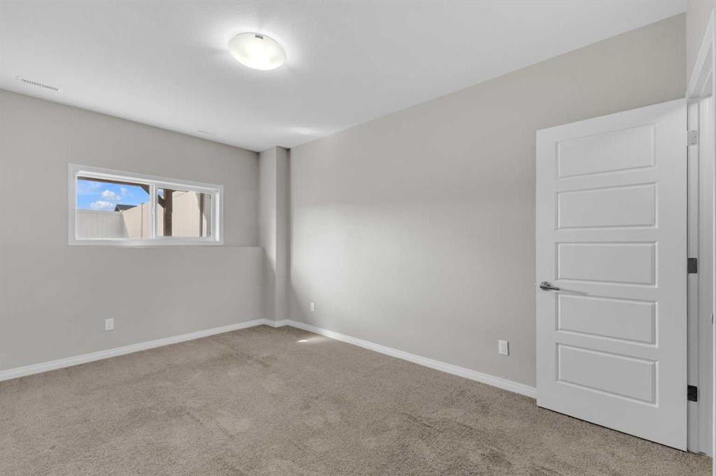 149 Hawkridge Boulevard, Penhold, AB - Indoor Photo Showing Other Room
