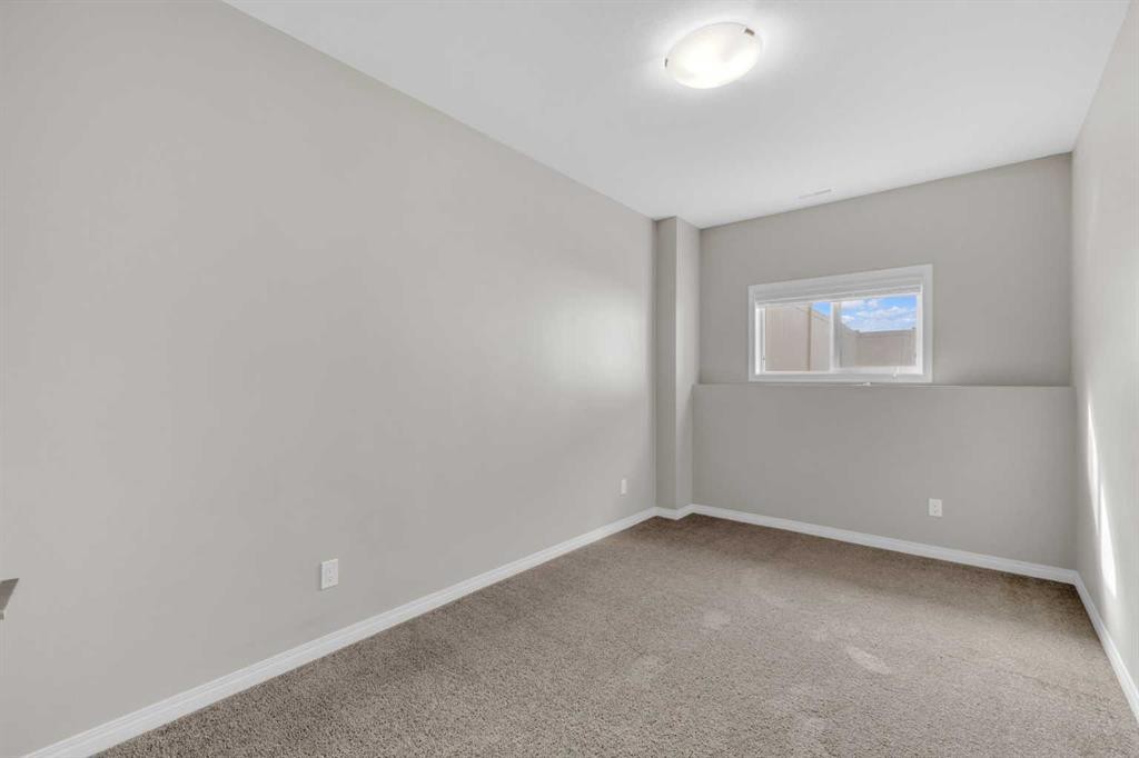 149 Hawkridge Boulevard, Penhold, AB - Indoor Photo Showing Other Room