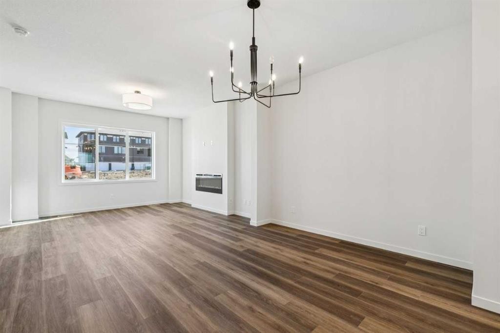 49 Bluerock Hill Sw, Calgary, AB - Indoor Photo Showing Living Room