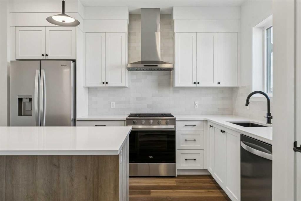 49 Bluerock Hill Sw, Calgary, AB - Indoor Photo Showing Kitchen With Upgraded Kitchen