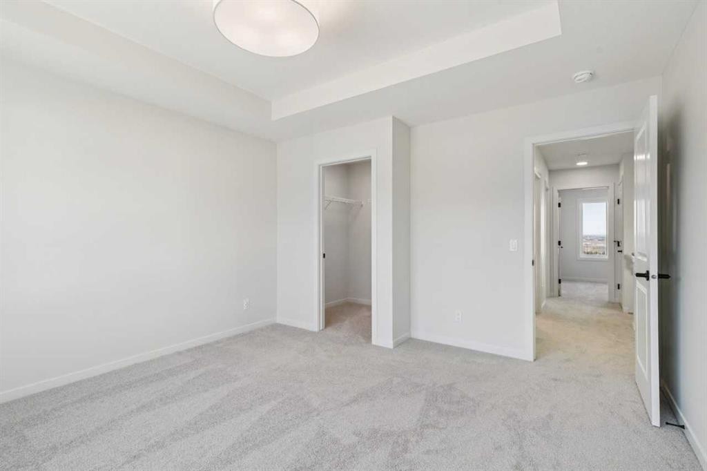 49 Bluerock Hill Sw, Calgary, AB - Indoor Photo Showing Other Room