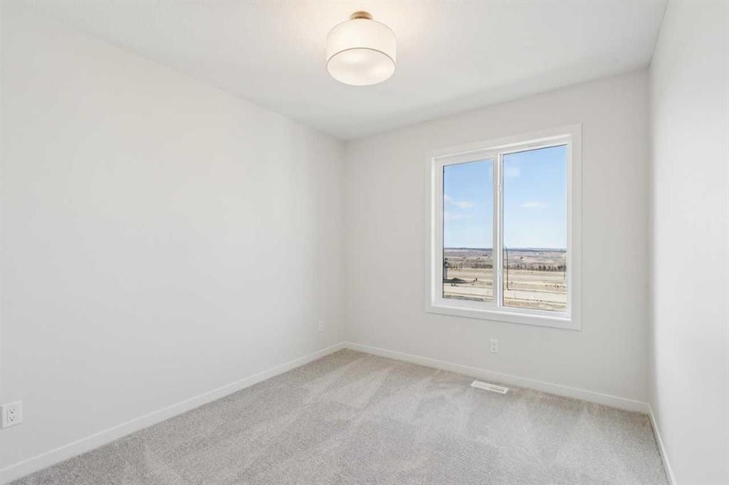 49 Bluerock Hill Sw, Calgary, AB - Indoor Photo Showing Other Room
