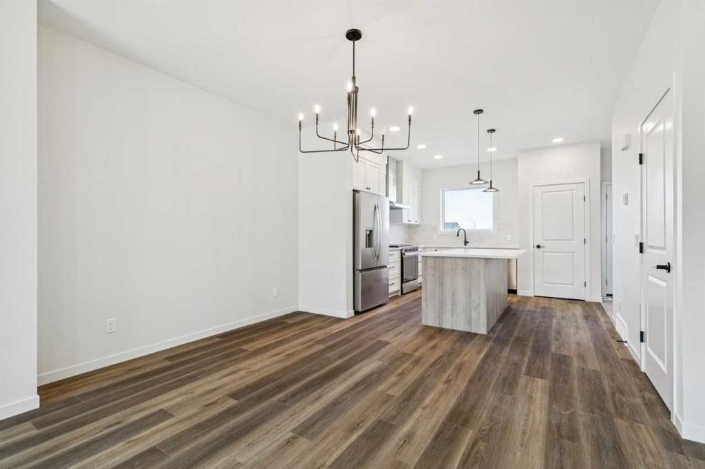 49 Bluerock Hill Sw, Calgary, AB - Indoor Photo Showing Kitchen With Upgraded Kitchen