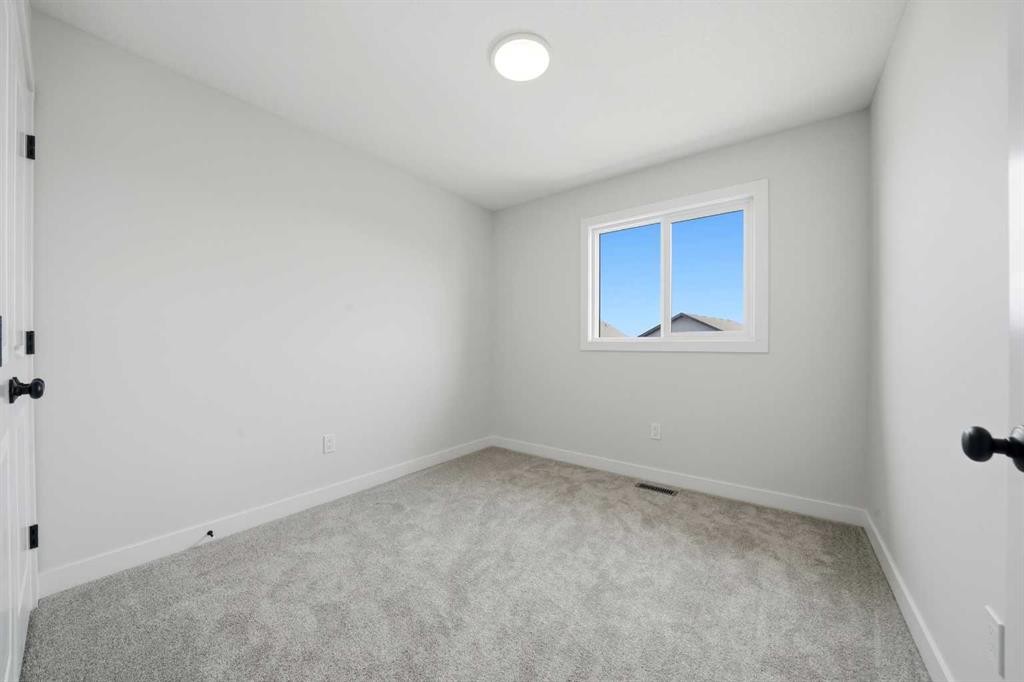 77 Pinnacle Close, Blackfalds, AB - Indoor Photo Showing Other Room