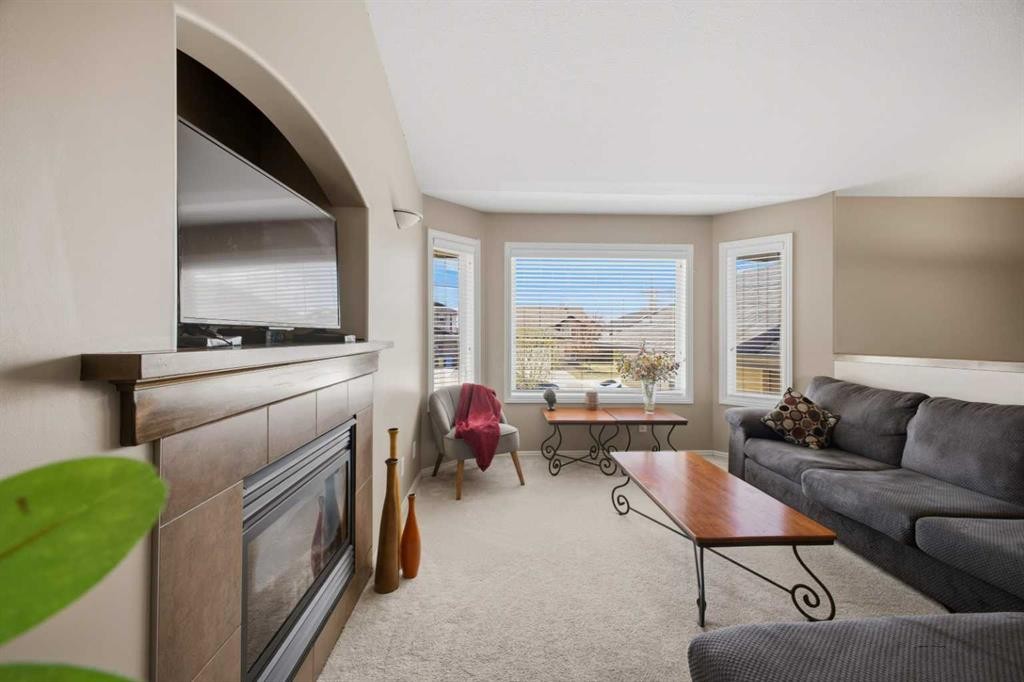 135 Issard Close, Red Deer, AB - Indoor Photo Showing Living Room With Fireplace