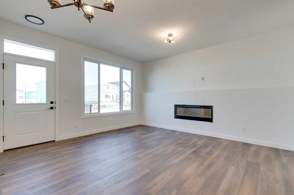 182 Lanark Gate Se, Airdrie, AB - Indoor With Fireplace