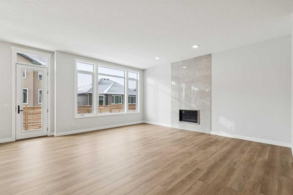 261 Dawson Wharf Crescent, Chestermere, AB - Indoor Photo Showing Living Room With Fireplace