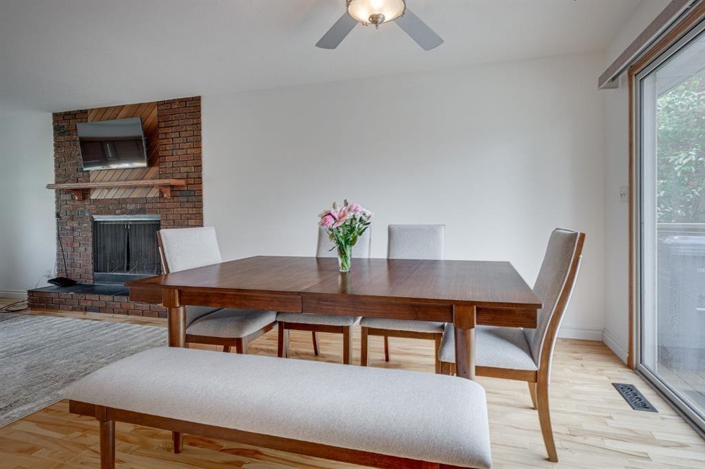 8 Nielsen Close, Red Deer, AB - Indoor Photo Showing Dining Room With Fireplace