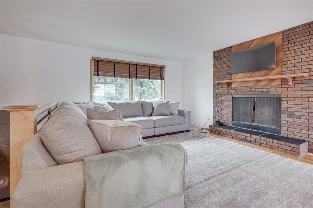 8 Nielsen Close, Red Deer, AB - Indoor Photo Showing Living Room With Fireplace