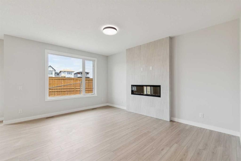 271 Bridgeport Circle, Chestermere, AB - Indoor Photo Showing Other Room With Fireplace