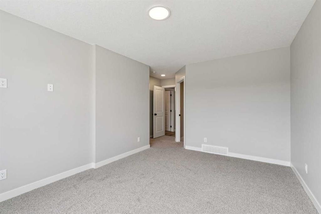 400 Fireside Drive, Cochrane, AB - Indoor Photo Showing Other Room
