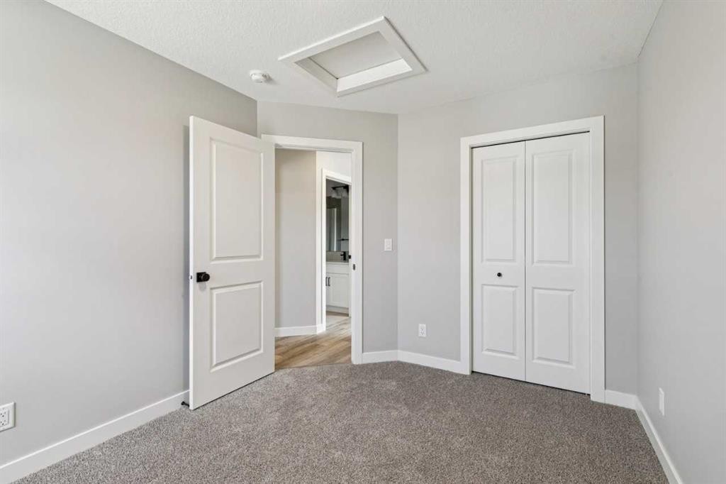 400 Fireside Drive, Cochrane, AB - Indoor Photo Showing Other Room