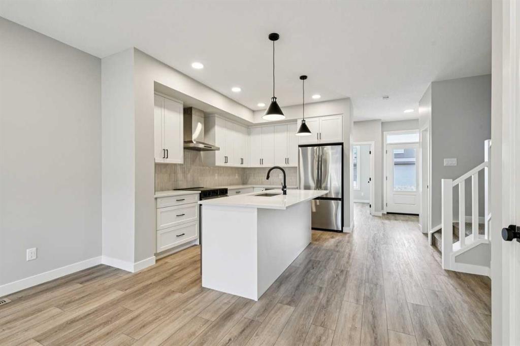 400 Fireside Drive, Cochrane, AB - Indoor Photo Showing Kitchen With Upgraded Kitchen