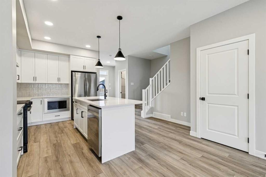 400 Fireside Drive, Cochrane, AB - Indoor Photo Showing Kitchen With Upgraded Kitchen
