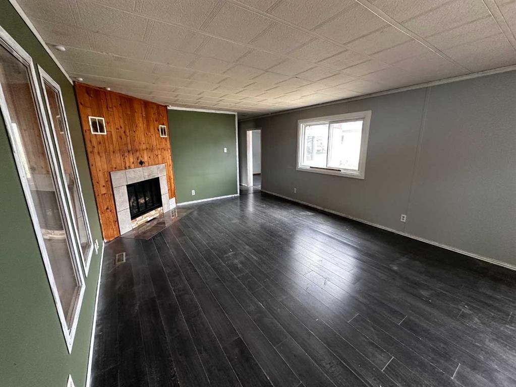 68 Norby Crescent, Red Deer, AB - Indoor Photo Showing Other Room With Fireplace
