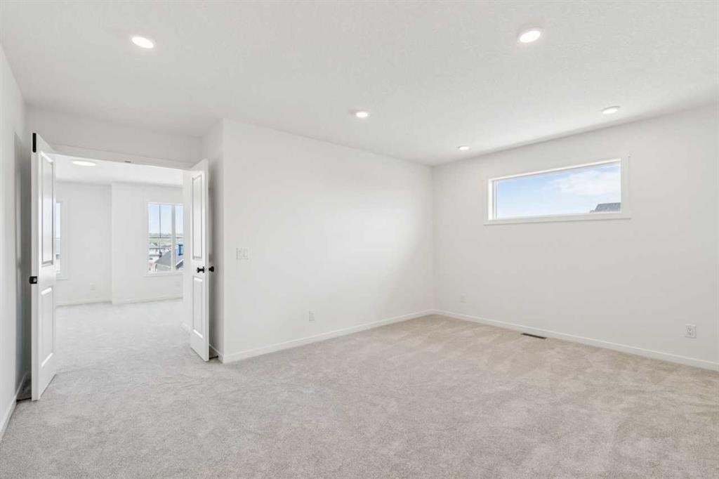 156 Southborough Common, Cochrane, AB - Indoor Photo Showing Other Room