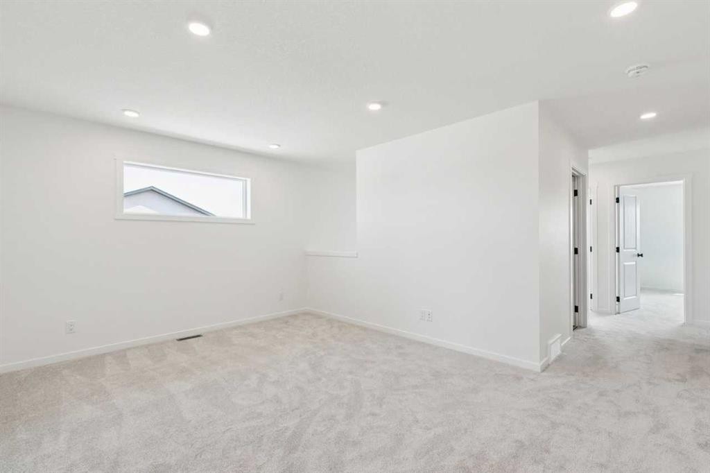 156 Southborough Common, Cochrane, AB - Indoor Photo Showing Other Room
